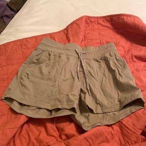 xs north face workout shorts! tan color